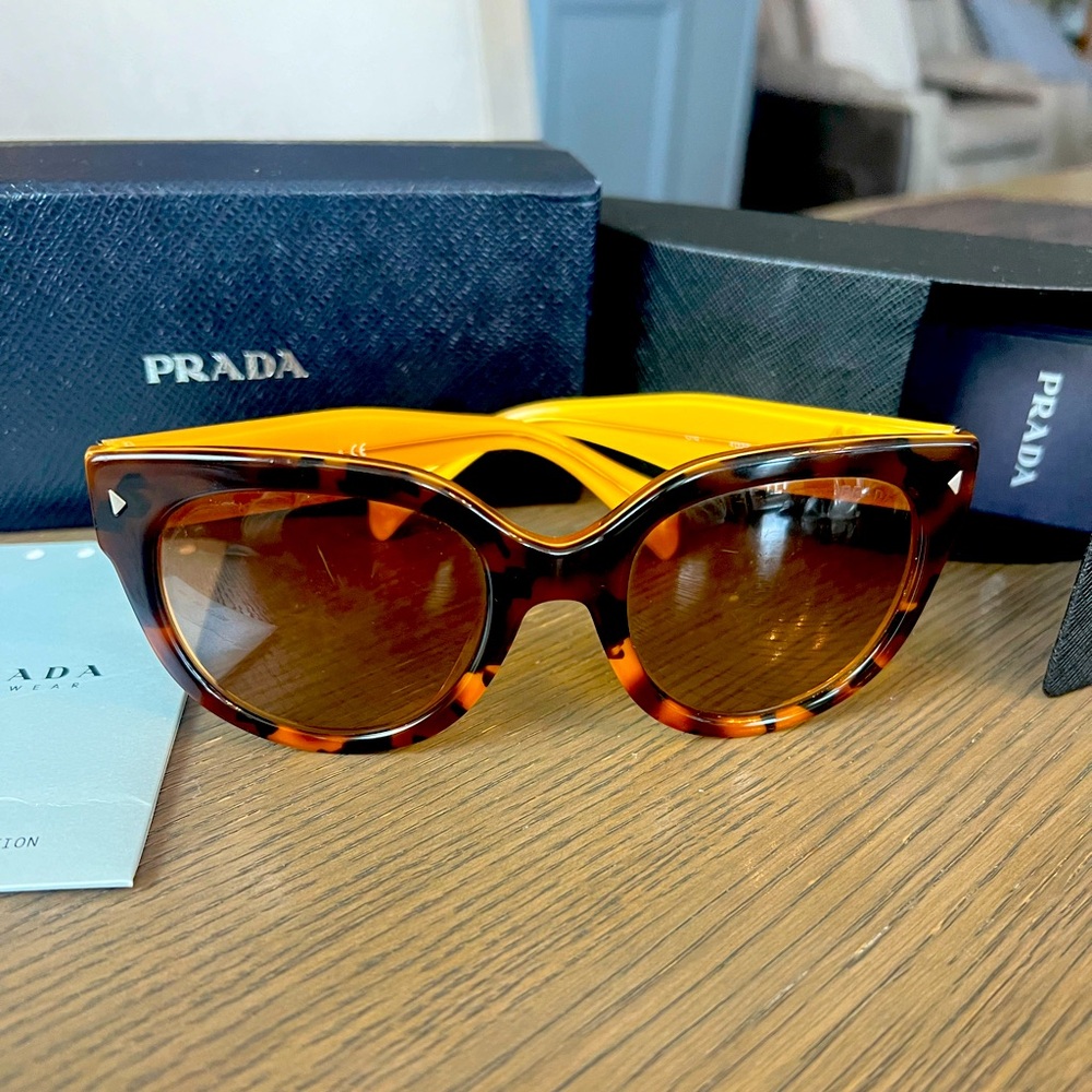 Prada sunglasses with box and case.